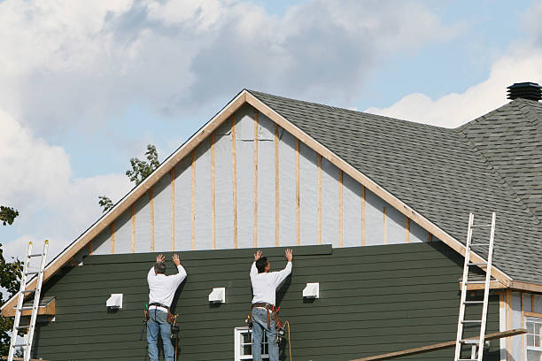 Professional Emergency Siding Repair technician working in Webster, IN